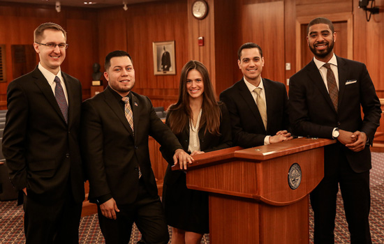 Suffolk University Law students gather for a portrait in the Moot Court room in Sargent Hall.