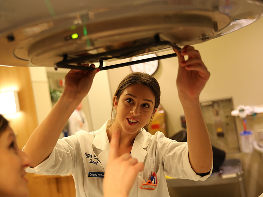 During radiation physics lab at Brigham & Women’s Hospital, students gain first-hand technical experience using a linear accelerator.