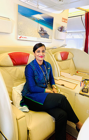 Sarika Nimkar, Class of 2024, on the job as an Air India flight attendant.