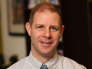 advisor jshields portrait in front of a bluring frame 