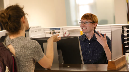 Student at the RAM Financial Center help desk