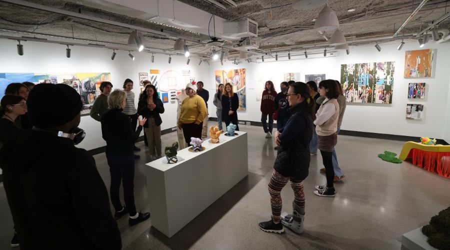 Gallery filled with people enjoying art