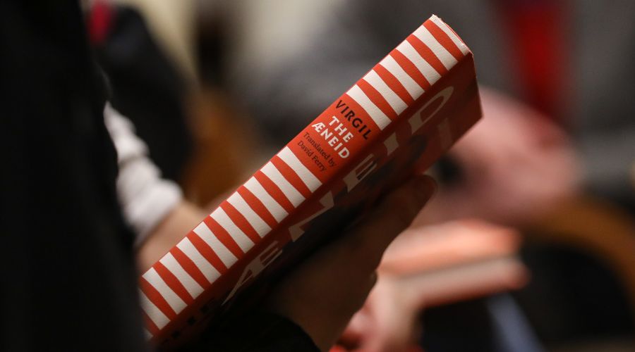 Copy of The Aeneid held in someone's hands