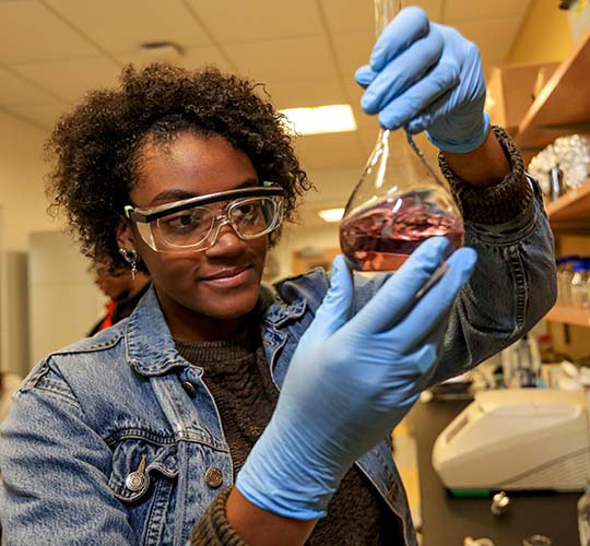 Student examines content of a beaker