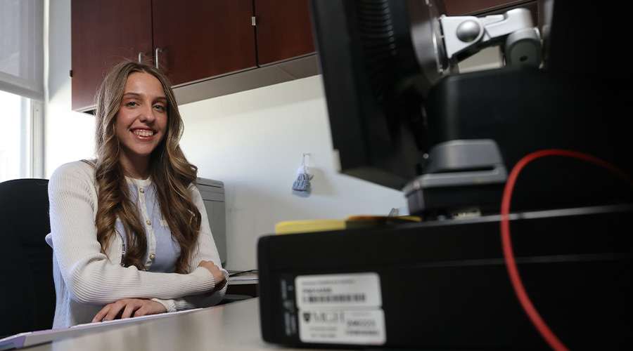 Lauren Costa, BSBA ’24, at her desk in Mass General’s Department of Neurosurgery
