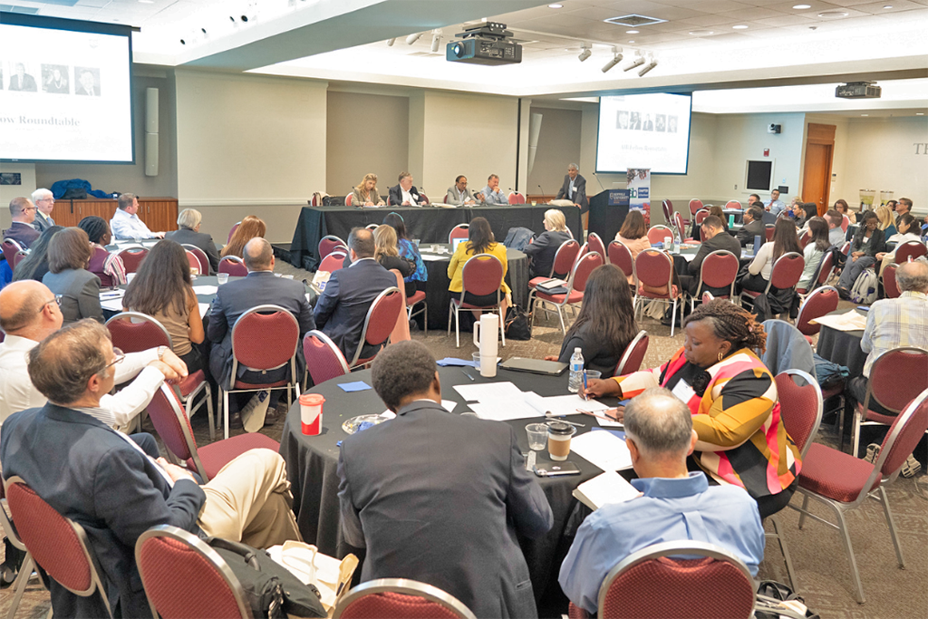 Attendees listening to a panel of speakers at the annual AIBNE Conference, 2024